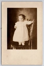 RPPC Darling Little Girl On Chair Real Photo Postcard I32