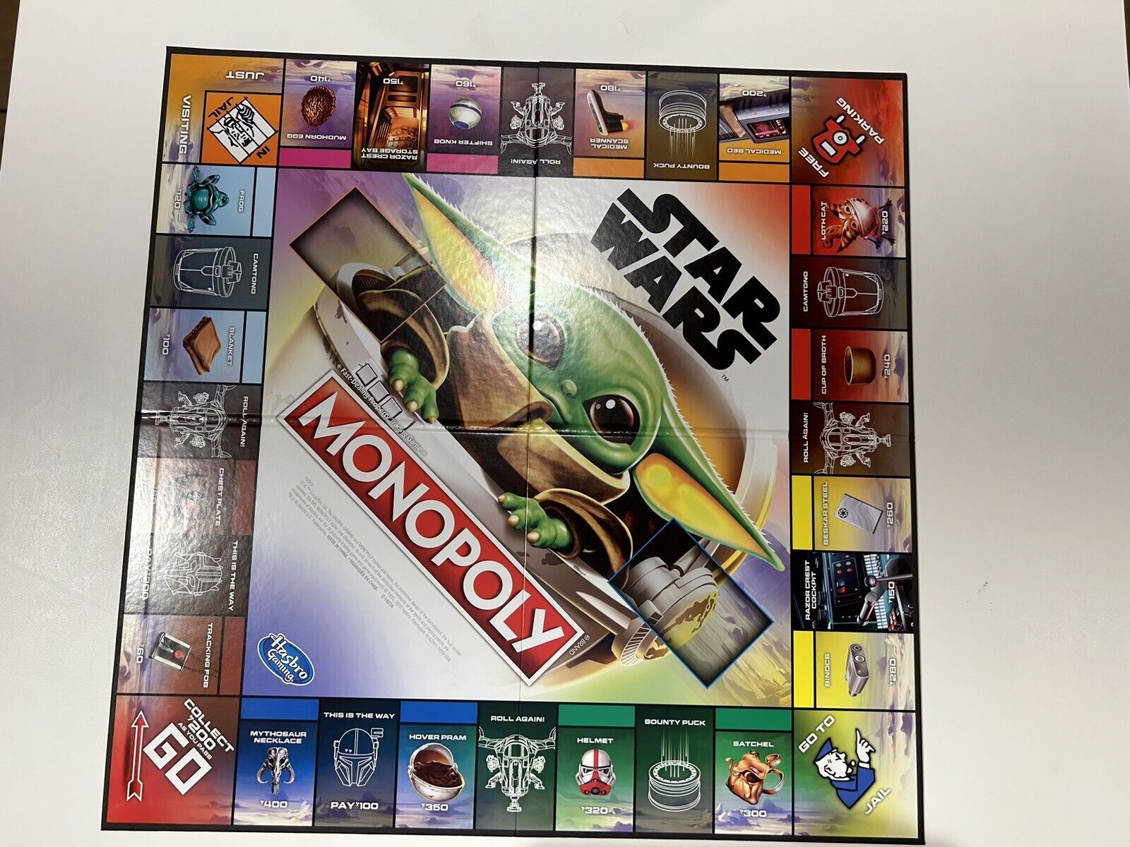 STAR WARS Jogo Monopoly The Mandalorian, Jogo de Tabuleiro - The Child  (Baby Yoda) - F2013 - Hasbro, Multicor