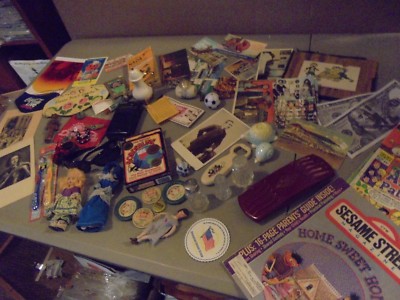 LARGE JUNK DRAWER LOT,DOLLS,POSTCARDS,SHAKERS,COMICS,AM/FM RADIO,MILK CAPS,STUFF