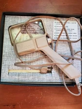 Donegan Optical Co, 2"x4" glass Masterpiece Illuminating Magnifier, works