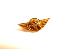 vintage United Airlines 100,000 miles aviation pin with wings on globe