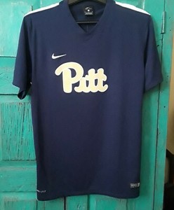 navy blue and gold nike shirt