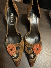 Prada suede kitten heels with floral appliqué details, likely from the 90’