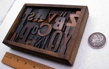 Vintage letterpress in a stained box w/ black twisted wire stand. Great type.