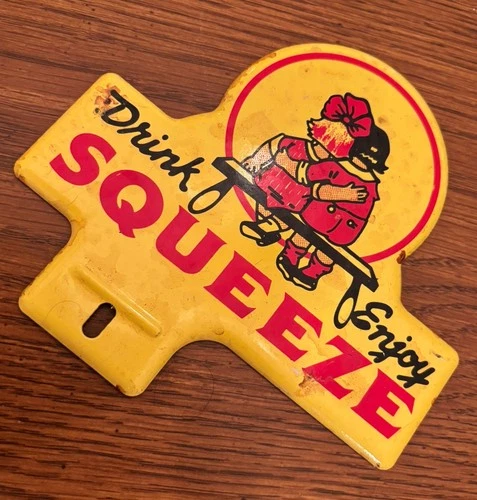 DRINK SQUEEZE SODA COLA 1950s ORIGINAL AUTO TAG SIGN FRAME GAS OIL VINTAGE METAL