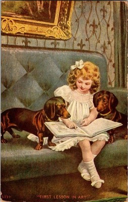 Antique PC of Little girl with two dachshund dogs showing her art book