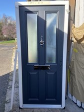 A NEW 895-2010  ANTHRACITE GREY  FRONT DOOR IN WHITE UPVC FRAME