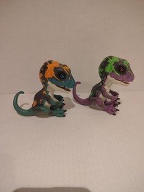 2 Fingerlings Untamed Razor Raptor Purple Dinosaur Interactive Toy WowWee