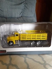 NIB 1/64 Yellow Pete 385 Stakebed SpecCast