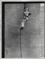 1960 Press Photo William Vreeland slides down a rope from carrier Constellation