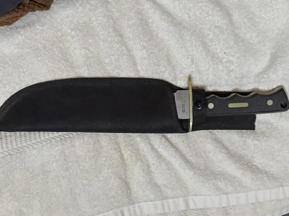 Cuchillo de hoja fija de acero inoxidable Schrade con funda Foto 2 de 3