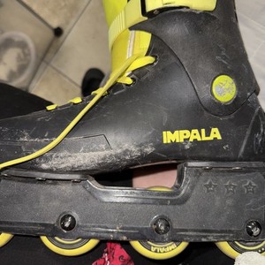 Impala green and black roller blades