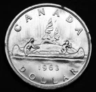 1963 $1 silver coin that is AU and in a paper flip. Gorgeous