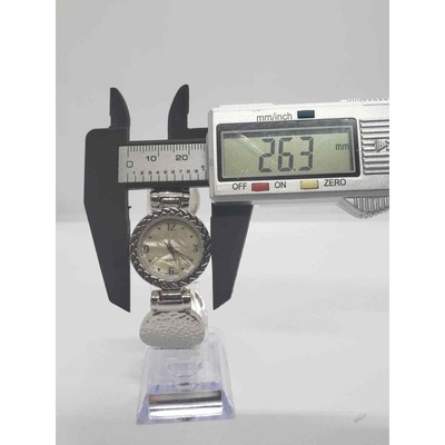 Women\'s silver dress watch. Ornate design on the bevel edge. Opalescent face. Women main image 3