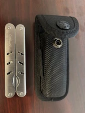 Camillus 13 in 1 multiple tool stainless steel with a belt sheath pouch