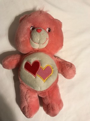 pink care bear with two hearts