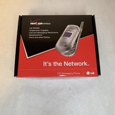 New LG VX3450 Flip Phone Silver Powers On. Phone, Manual, and Battery.