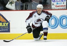 Ossi Vaananen Colorado Avalanche kneels at the game v the Ph- Ice Hockey Photo