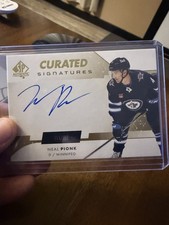 Neal Pionk 2022-23 SP signatures authentiques organisées 99/199 Winnipeg 