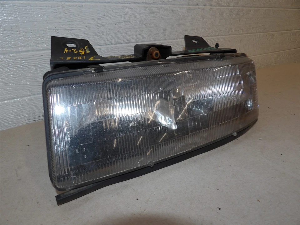 FARO PONTIAC TEMPEST CHEVY CORSICA 1989 MONTAJE LADO CONDUCTOR IZQUIERDO CON SOPORTE Foto 2 de 4