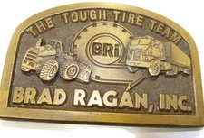 Vintage Brad Ragan Inc. Belt Buckle The Tough Tire Team Spec-Cast