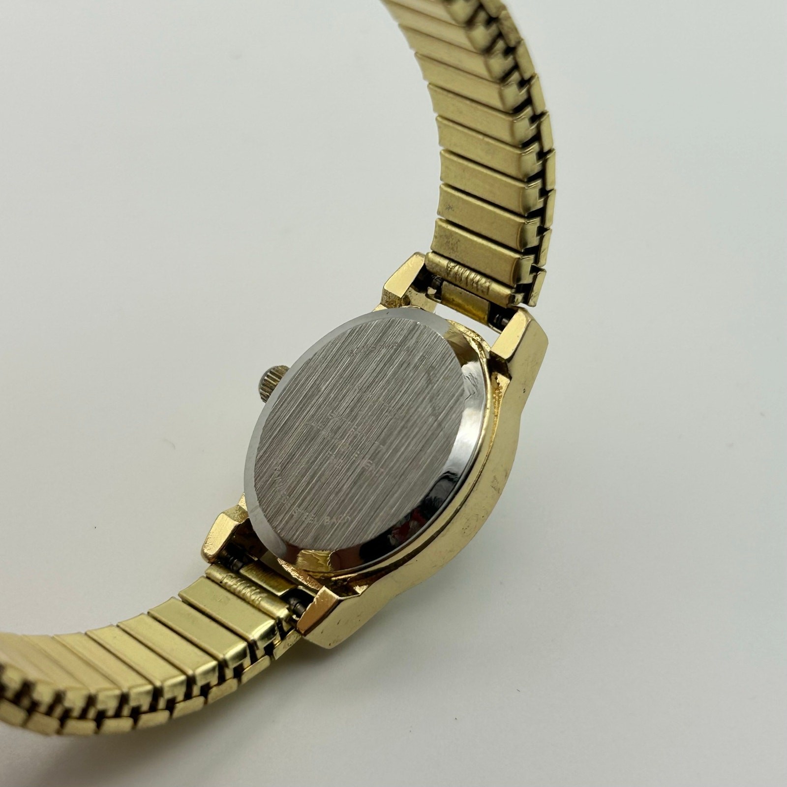 Gold-tone Oval Case Stainless Steel Stretch Band Women’s Watch Working image 6