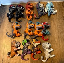 Lot of 13 WowWee Untamed Fingerling Dinosaurs Sabertooth Wolf