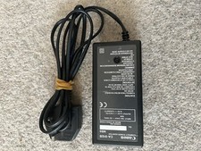 Canon Battery Charger CA-910BMB9 + 4x Canon Batteries + Coupler