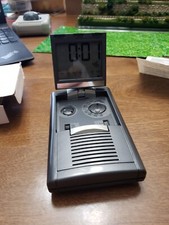 AM/FM Clock Radio With Folding Display Travel Mate.bx1