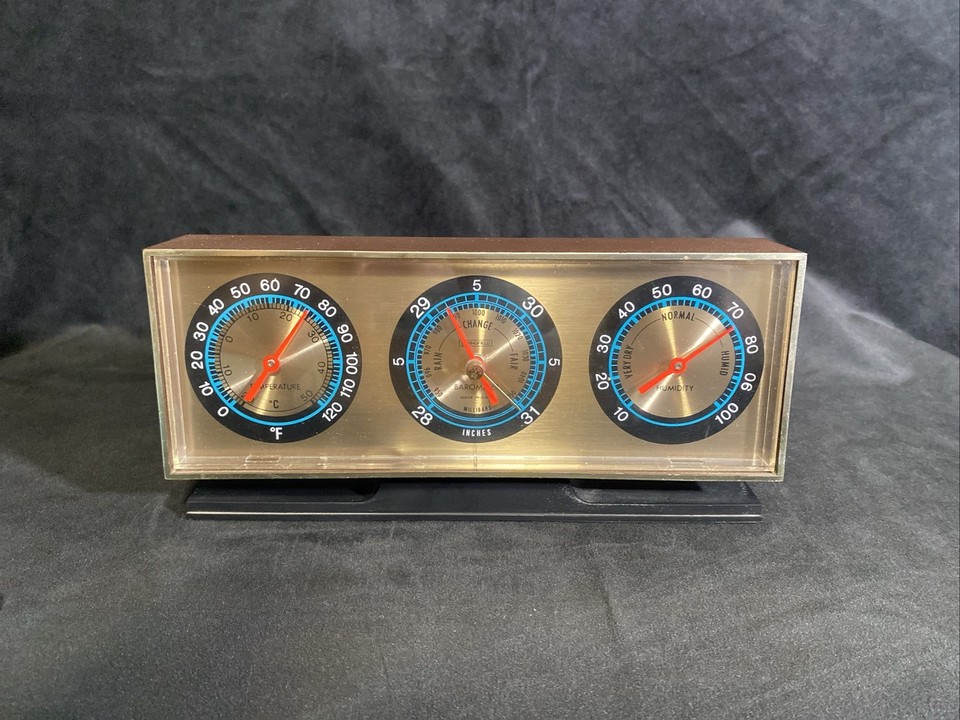 A sleek mid-century desk barometer/hygro/thermometer combo that looks like it belongs in a 1960s NASA control room.