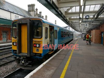 PHOTO  A SINGLE CAR CLASS 153 UNIT 153367 IN SHREWSBURY STATION HAVING COME OFF