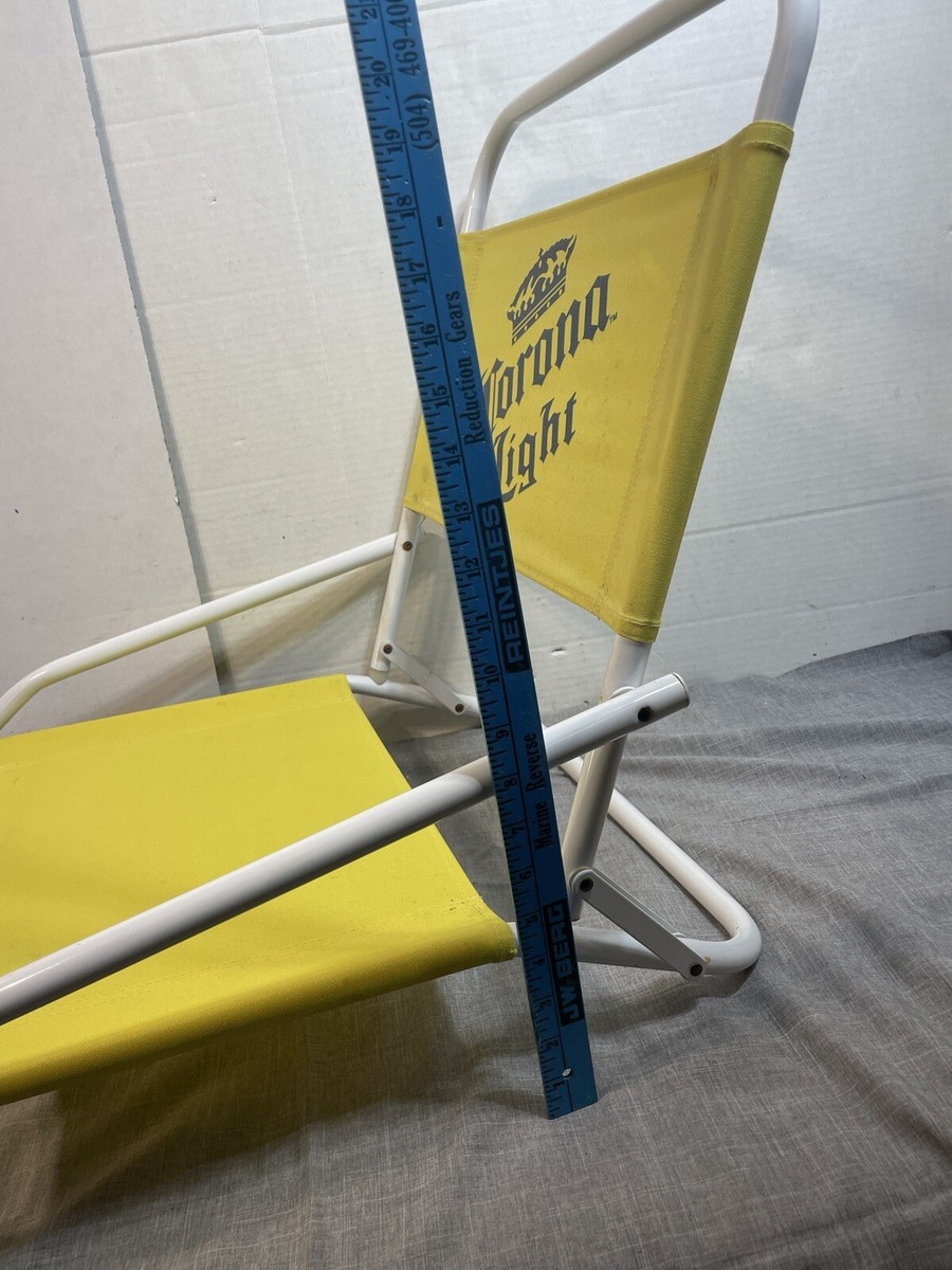 pair of corona light yellow low sitting beach chairs folding
