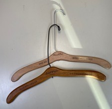 Two wooden Vintage Chicago furrier hangers