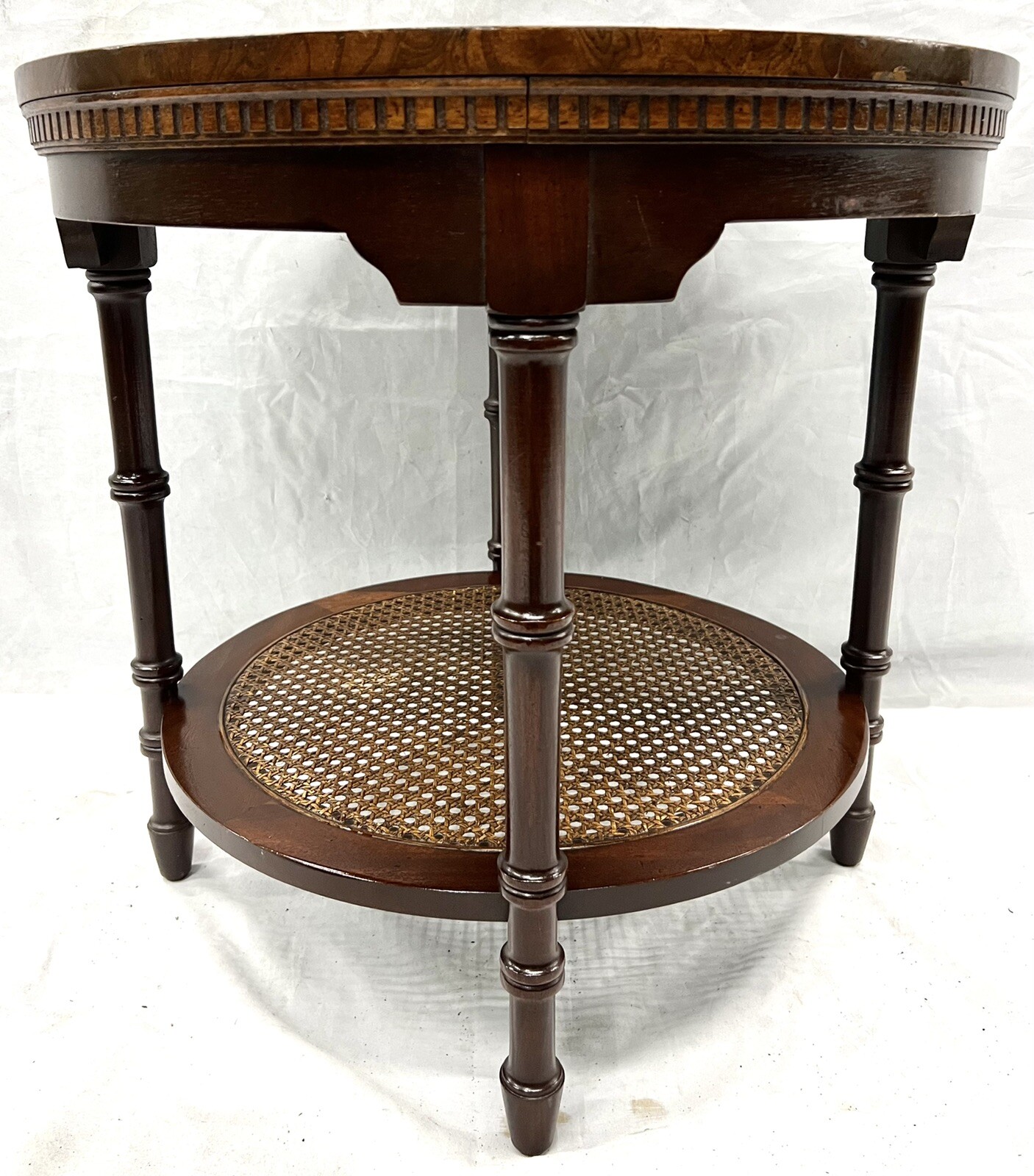 Hekman antique two tier, tooled leather /woven rattan burled wood round