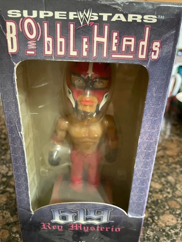 WWE Rey Misterio bobble head doll.  New in box, small tear in box, but unopened