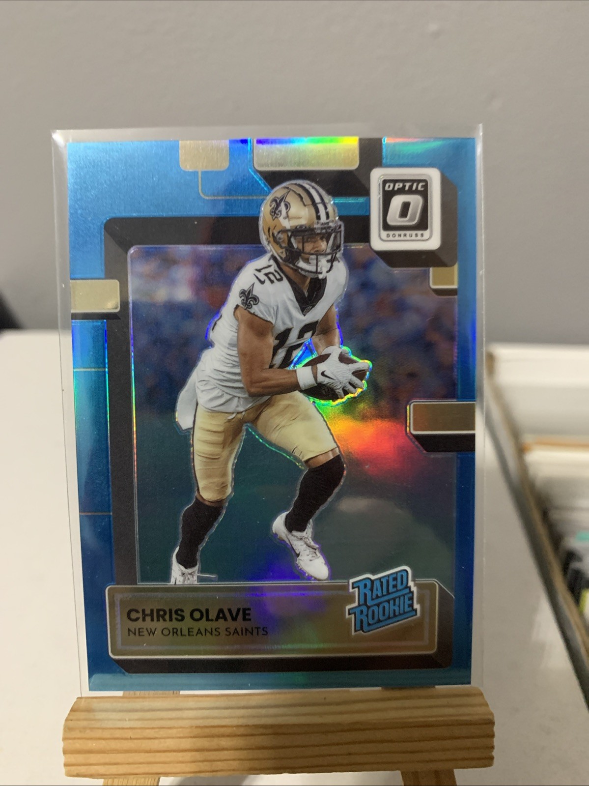 2022 Chris Olave Optic Rated Rookie Aqua Prizm /299 #209 (RC) New Orleans Saints