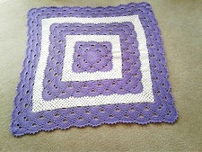 Hand crocheted lacy lavender and white afghan