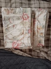 Good condition. Pair of floral lined curtains approx 65" across drop 51"
