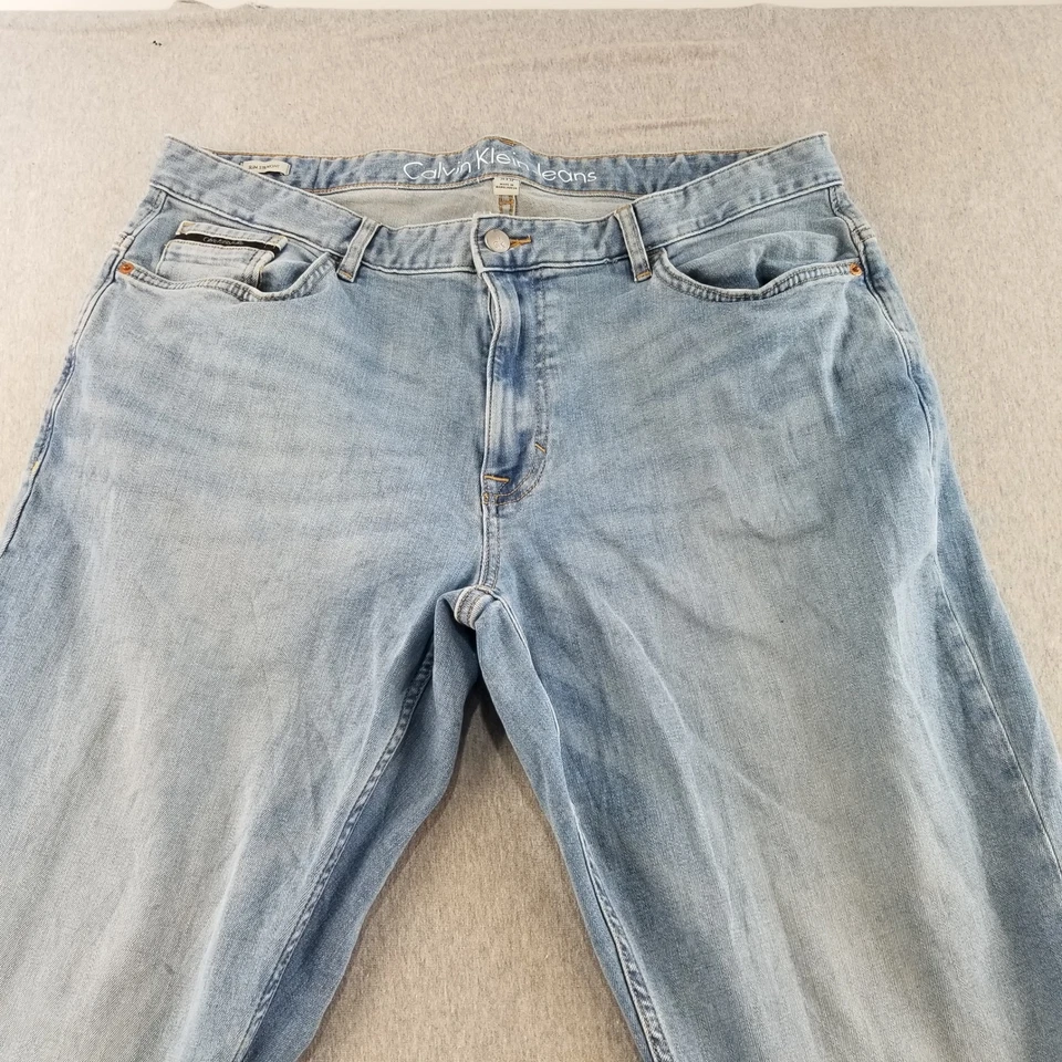 Pantalones de mezclilla Calvin Klein para hombre talla 36x32 azul lavado medio ajustados rectos rotos cómodos Foto 2 de 4