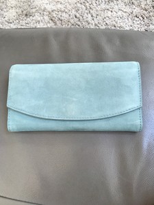powder blue suede clutch bag