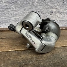 Deragliatore posteriore vintage Shimano RX100 RD-A550 7 velocità gabbia corta bullonato argento