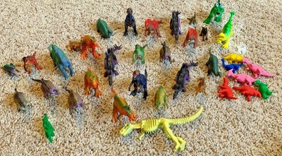 small plastic dinosaur figures