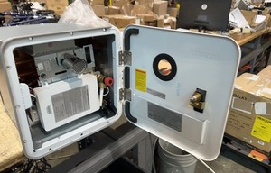 Used 2.5GPM 48,000 BTU RV Tankless Water Heater with 15x15 White Door