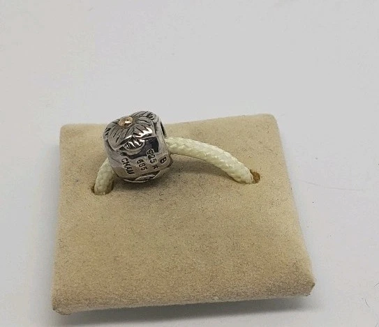 DIJE FLOR CHAMILIA PLATA ESTERLINA Y ORO 14K Foto 2 de 3