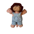 vintage Cabbage Patch Kids Koosas pet doll with curly brown hair.