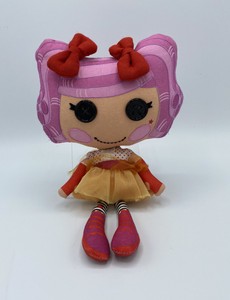 doll with button eyes and pink hair