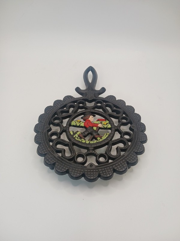 1952 Cast Iron Trivet Amish Boy With Walking Stick With Hearts And Wreath