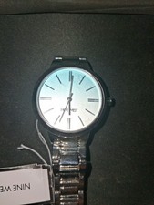  Nine West Women's Bracelet Watch (model NW/3261BLSV) features a silver-tone adj