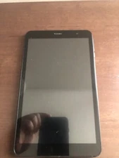 balck tablet bundled  with charger and turns on