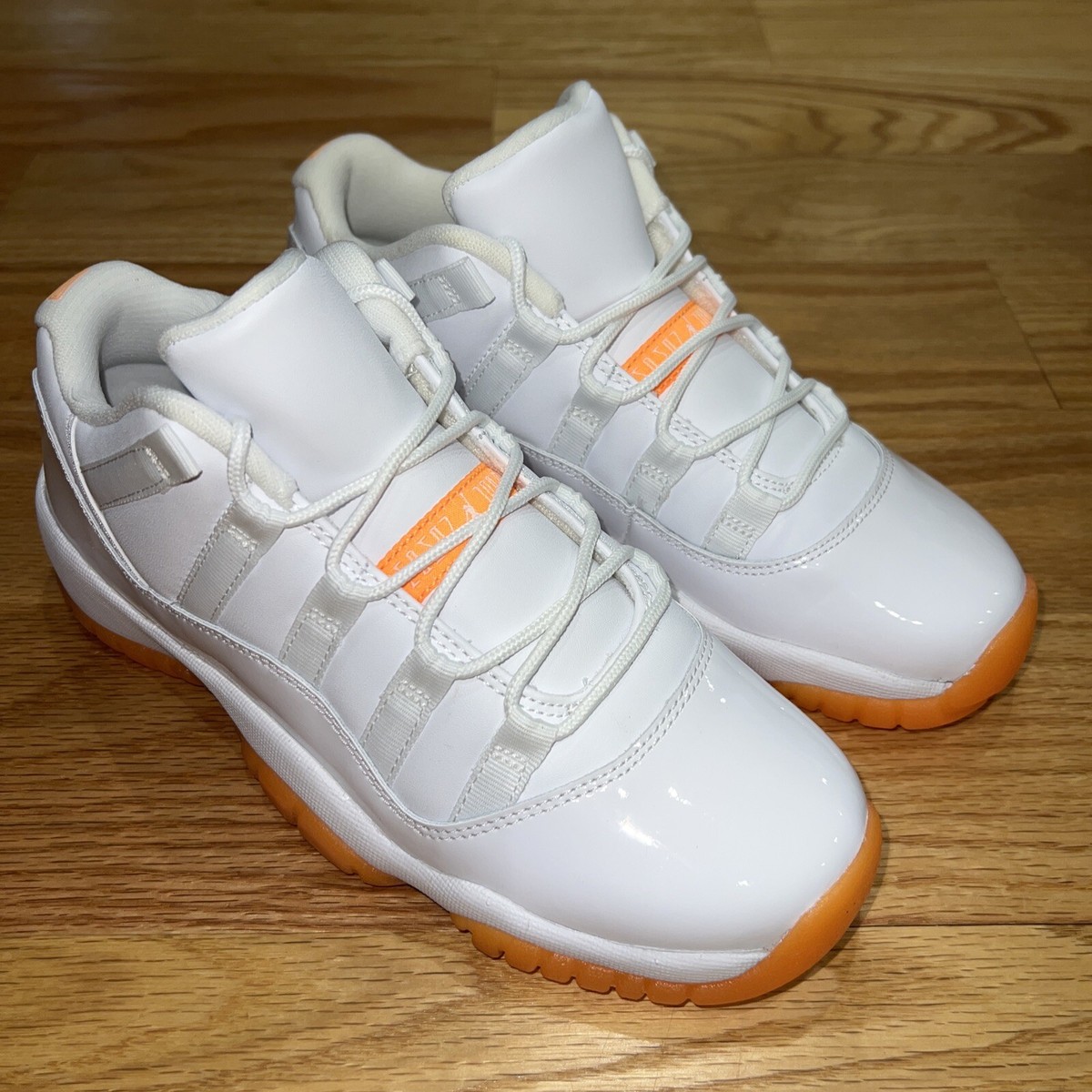 AIR JORDAN XI 11 RETRO LOW GG WHITE/CITRUS ORANGE 580522-139 AIR JORDAN XI 11 RETRO LOW GG WHITE/CITRUS ORANGE 580522-139